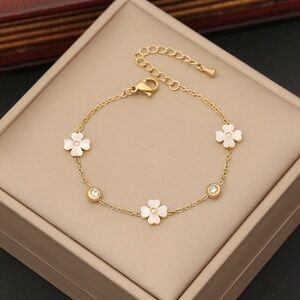 Elegant Gold and White Floral Bracelet
